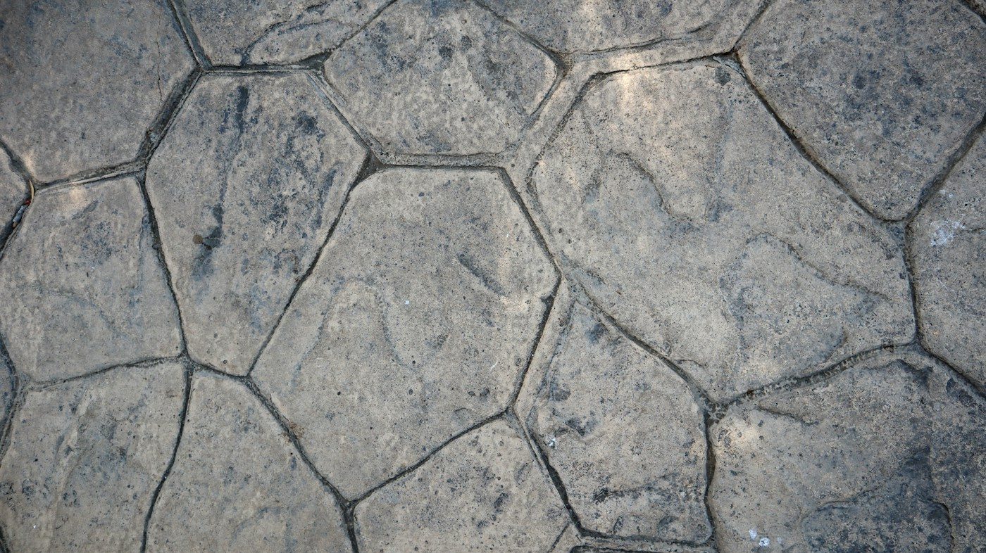 Grey stamped concrete with a flagstone pattern